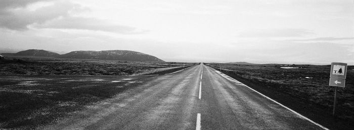 Road amidst landscape against sky