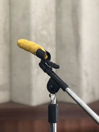 Close-up of microphone against wall