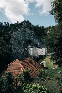 Buildings in town against sky