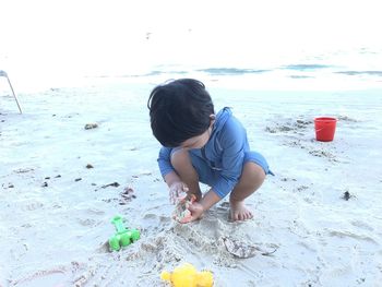 Rear view of boy on beach