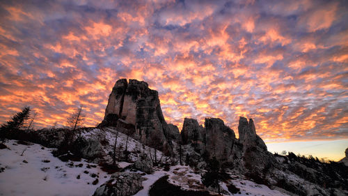 Rock formations against sky during sunset