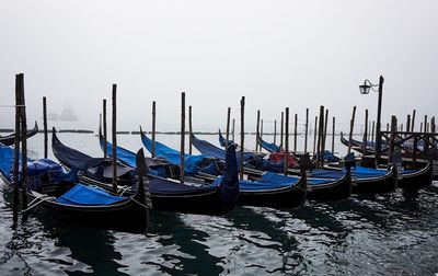 Boats moored in water