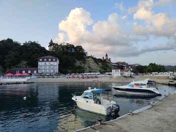 Boats in sea against sky