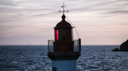 Sailboat on sea against sky during sunset