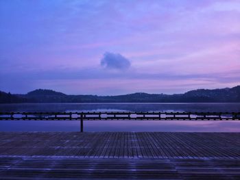 Scenic view of lake against romantic sky at sunset