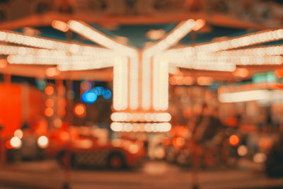 Defocused image of illuminated city at night