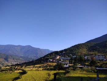 Scenic view of mountains against clear blue sky