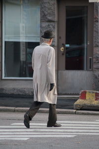 Man crossing street in city