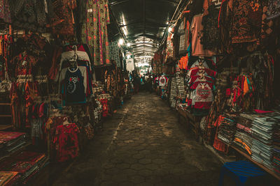 Illuminated street lights at market stall