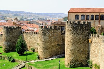 Buildings in town against clear sky