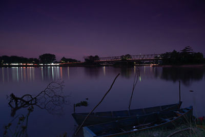 Scenic view of lake against sky at night