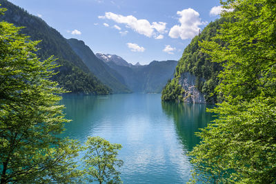 Scenic view of lake and mountains against sky