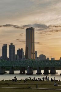 Buildings in city at sunset