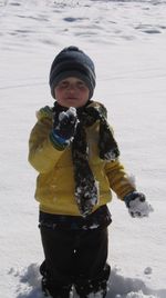 Portrait of boy standing in frozen sea