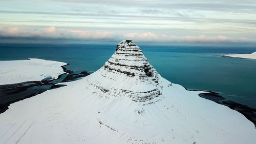 Scenic view of sea against sky during winter