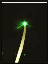 Illuminated street light at night