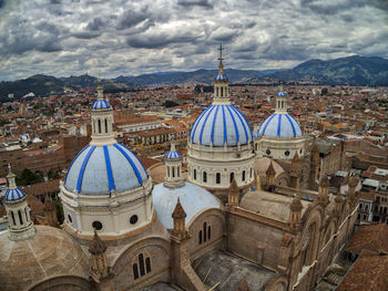 Panoramic view of buildings in city against sky