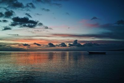 Scenic view of sea against sky at sunset