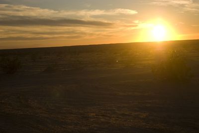 Scenic view of landscape against sky during sunset