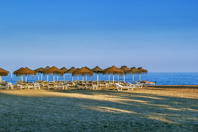 View of beach in torremolinos with umbrellas, spain.