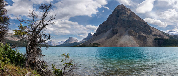 Scenic view of lake and mountains against sky