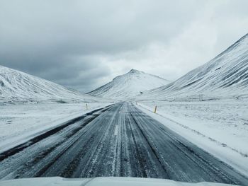 Tire tracks on road in winter