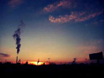 Silhouette of landscape against sunset sky