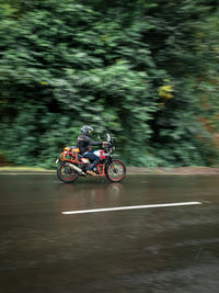 People riding motorcycle on water