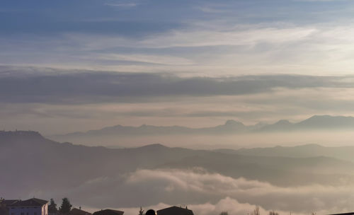 Low angle view of mountains against sky during sunset