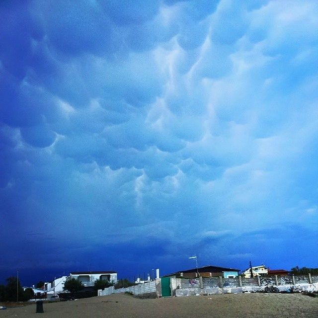 sky, cloud - sky, blue, cloudy, cloud, built structure, transportation, architecture, sea, water, building exterior, nature, mode of transport, nautical vessel, beauty in nature, outdoors, scenics, tranquility, day, no people