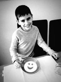 Boy playing on table at home