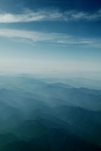 Scenic view of mountains against cloudy sky