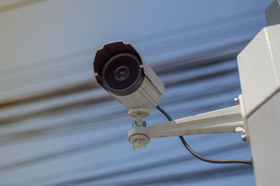 Close-up of coin-operated binoculars against ceiling