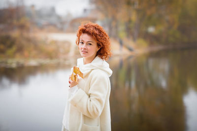 Happy redhair woman in white clothes