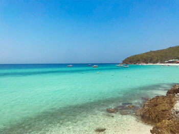 Scenic view of sea against clear blue sky