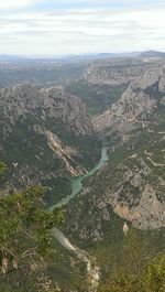 Scenic view of mountains against cloudy sky