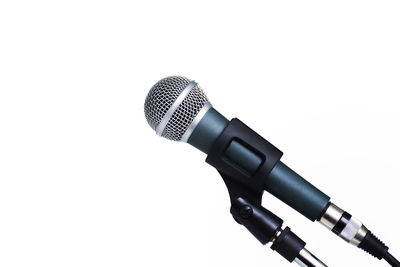 Close-up of microphone against white background