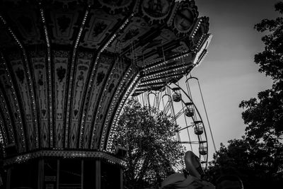 Low angle view of ferris wheel against sky