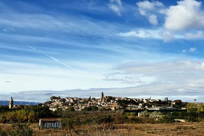 Scenic view of townscape against sky