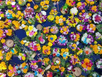 Full frame shot of religious offerings in river