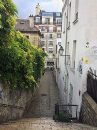 Alley amidst buildings in city