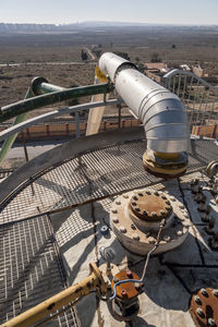 High angle view of machinery on field against sky