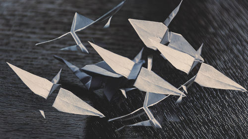 High angle view of paper crane on table