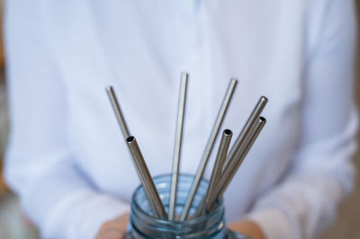 Close-up of hand holding metal