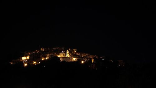 High angle view of buildings lit up at night