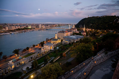 High angle view of buildings by sea against sky