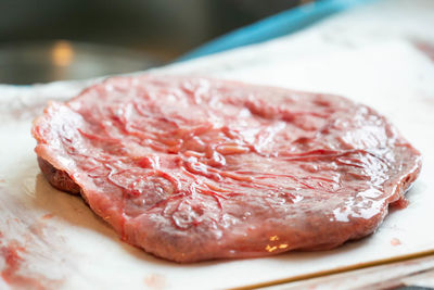 Close up of clean placenta on white pad with visible veins and ateries