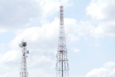 Low angle view of communications tower against sky