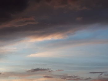 Low angle view of cloudy sky during sunset