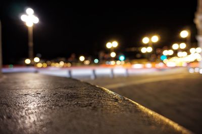 Close-up of street light on road at night